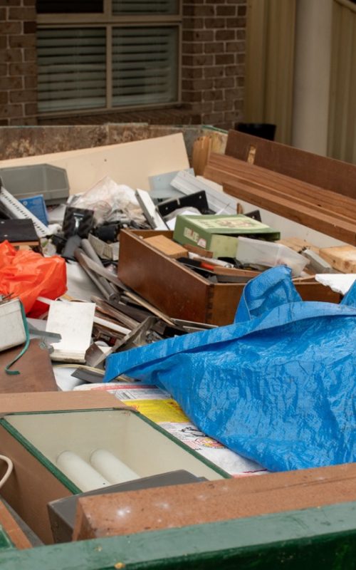 Sydney,,Australia,2020-02-15,Skip,Bin,Full,Of,Household,Waste,Rubbish Sydney, Australia 2020-02-15 Skip bin full of household waste rubbish on the front yard. House clean up concept